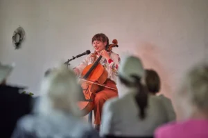 a woman playing a cello