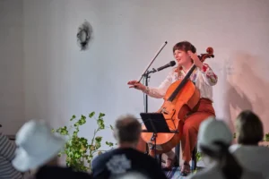 a woman playing a cello