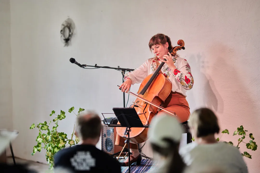 a woman playing a cello