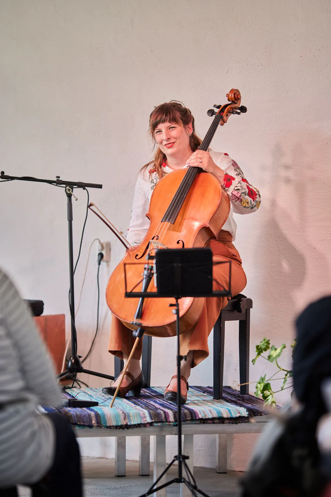 a woman playing a cello