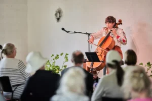 a woman playing a cello